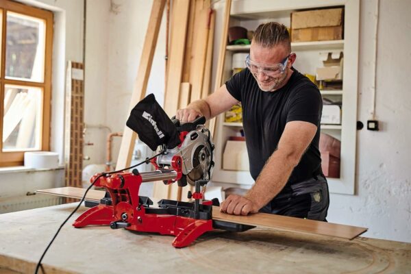Einhell TC-SM 2131/1 Dual Bevel Sliding Mitre Saw | Double Bevel Circular Saw, 310mm Drag, Laser, Dust Extraction, +/-45° Mitre, +/-47° Bevel | Saw with 48T Blade for Cutting Wood, Plastic, Red